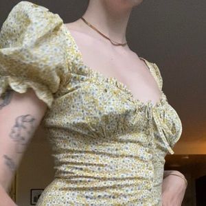 Summer minidress. Pastel yellow with white and green flower design.